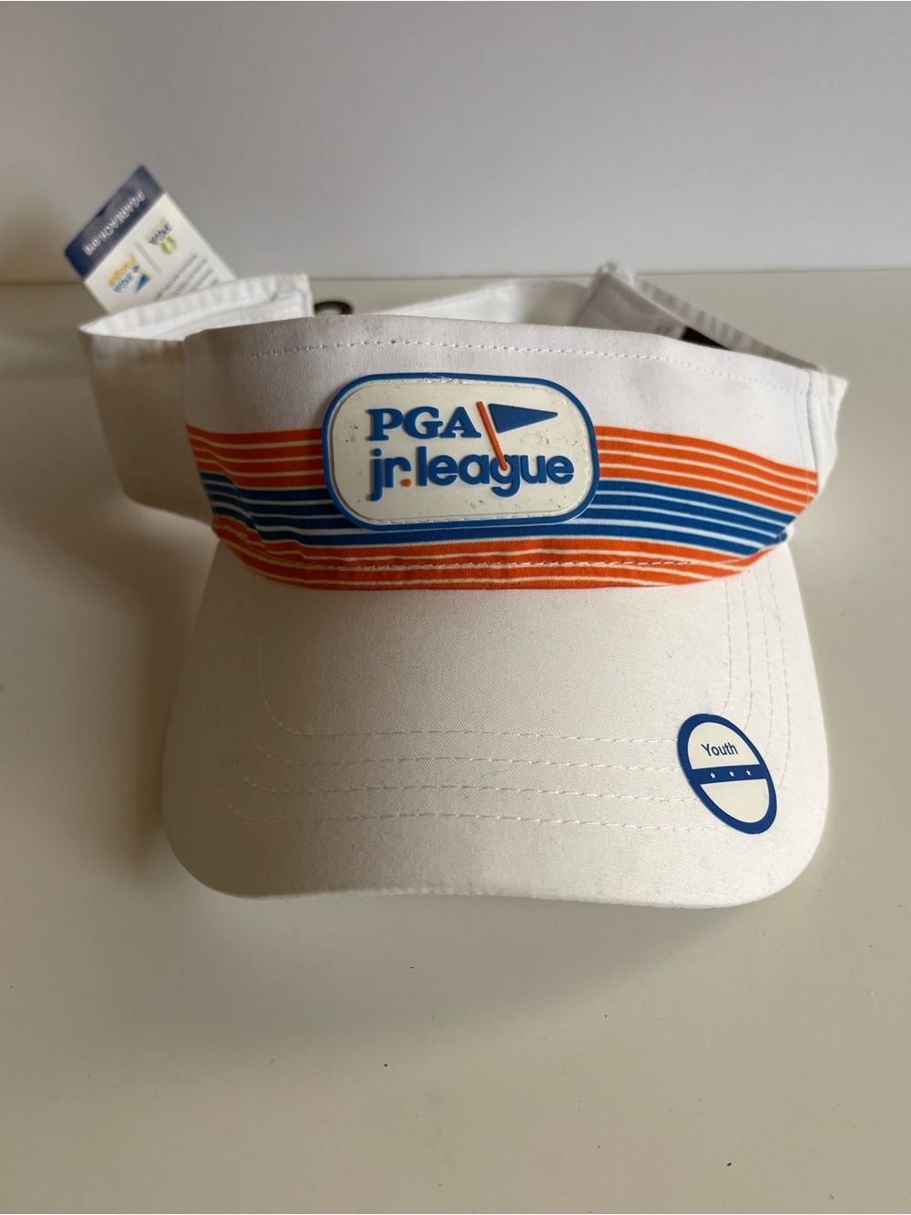 PGA Jr. League White Youth Visor with Orange & Blue Stripe Detail